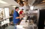 Stacy Hinkle and cook and relief manager Cheryl Hand, prepare a meal at a Lone Tree worker camp in Pennsylvania.