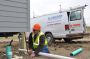 A contractor from Alexandria, Minn., installs the plumbing in one of the new two-bedroom units at Williston.