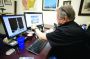 Sempco Surveying Oil and Gas Division Manager George Hill works on a surveying program on his computer at the company’s office.