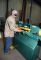 Key Welding employee Lloyd Kearns operates the company’s Piranha Ironworker (MegaFab) as he inserts a small sheet of metal into it to bend it.