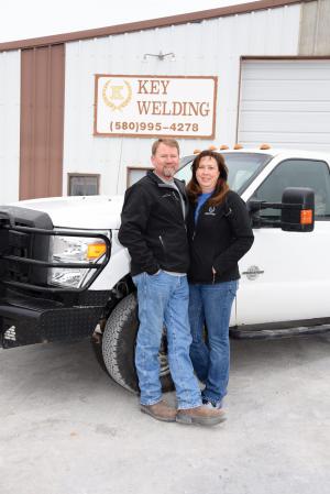 Key Welding owner Bill Key and his wife, Leann, stand near one of the Ford service trucks outside their shop in Vici, Oklahoma. Bill founded the oilfield welding company in 1989. Key Welding serves western Oklahoma, southern Kansas and the Texas Panhandle with 15 employees.