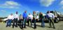 The corporate staff at Mustang Oilfield Services includes, from left, Jim Neff, St. Clairsville yard manager; Chase McCarthy, director of business development; Ryan Coffman, field supervisor; Greg Cook, CEO and owner; Larry Trank, field supervisor; Megan Cook, director of marketing; Taylor Hill, office manager; and Gary Shaffer, people solutions manager.
