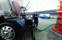 Field crew employee Gordon Hennebert attaches a hose from his truck to a frac water tank located at Frac Water Resources in Allenport, Pennsylvania, to withdraw water to transport to a nearby job site.