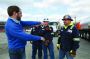 Greg Cook, CEO and owner, instructs his staff, William Bower, Gordon Hennebert and Ben Stoneking, at a job site in Allenport, Pennsylvania. All three drivers were on hand to take in water from the frac water tank site.
