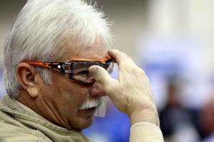 A WWETT Show attendee tries on safety glasses from Brass Knuckles Protection on Thursday during the WWETT Show.