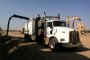 A crew from C Company in Williston, North Dakota, sits on an oil rig site performing hydroexcavating services. With the downturn in oil prices, vacuum excavation companies working in the oilfields have had to find other industries to serve.