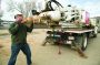 Patrick Hartford attaches an auger bit on the company’s Ford F-650 auger truck’s kelly bar. The truck is one of the company’s most used pieces of equipment.